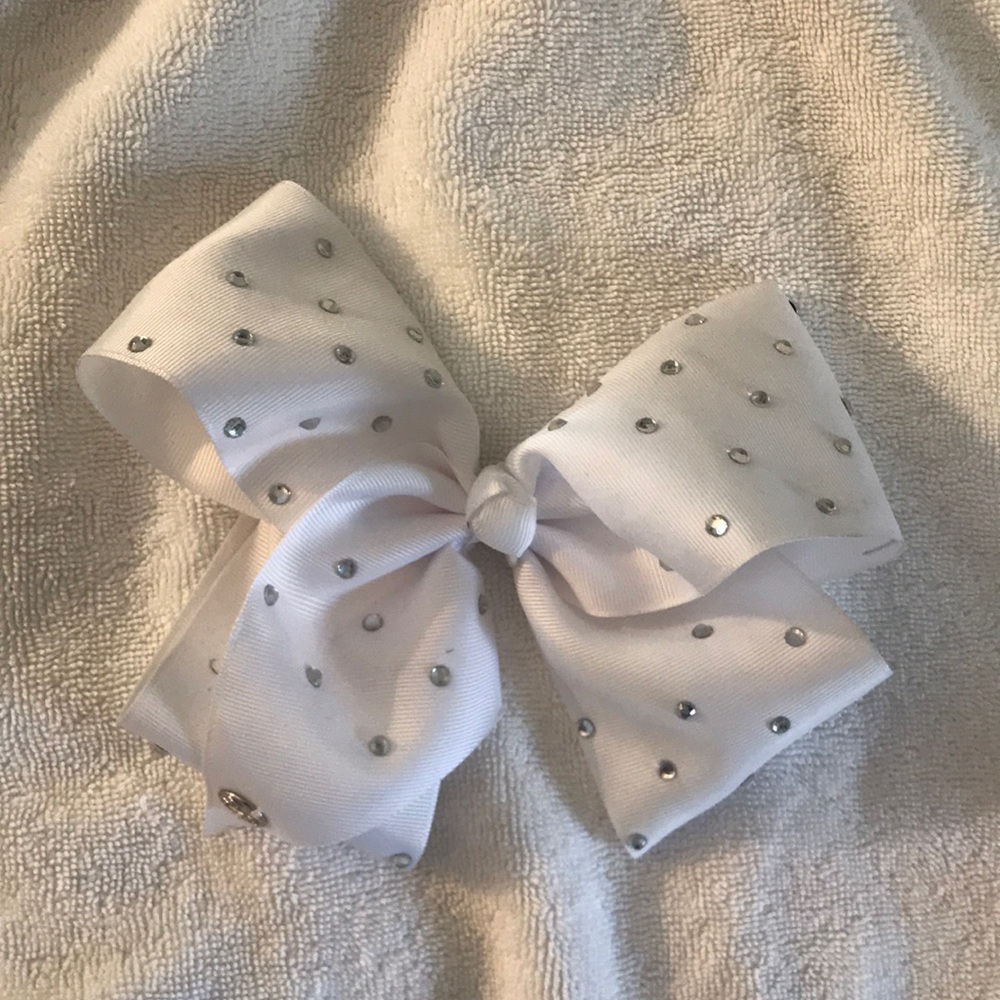 Jo Jo Siwa  Oversized white / rhinestone bow.